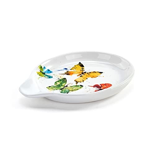 Butterfly-shaped spoon rest made of ceramic with floral design
