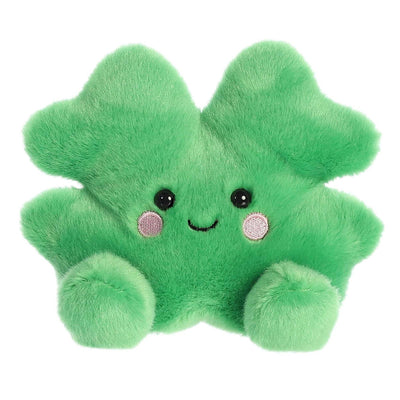 Stuffed four-leaf clover shaped toy with a smiley face. The clover is green and has four leaves.