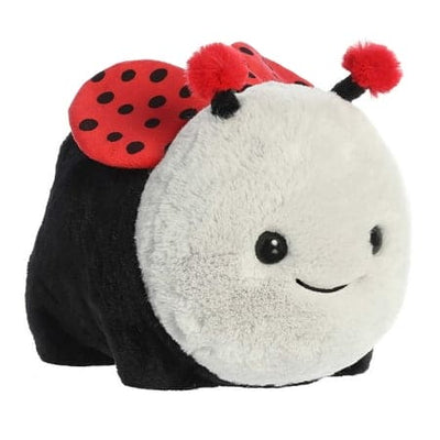 A red plush ladybug with black spots and a smiley face.