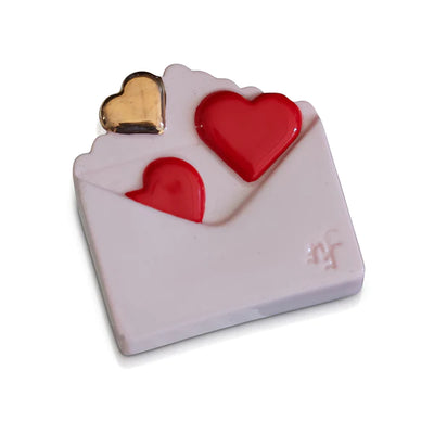 White envelope with two red hearts on a white background