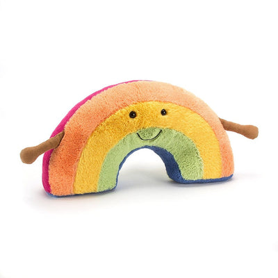Stuffed rainbow plush toy with arms and a face.