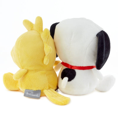 Two magnetic plush toys: a white dog and a yellow duck sitting side-by-side.