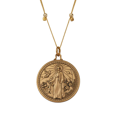 A gold tone necklace with a circular pendant enclosed in a gold border. The pendant has a colorful image of Virgin Mary. The text “Divine Mother” is written on the back of the pendant.