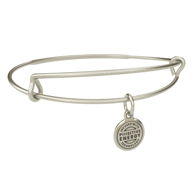 Silver bangle bracelet with a positive energy charm. The charm is round and silver with a plus sign (+) in the center.