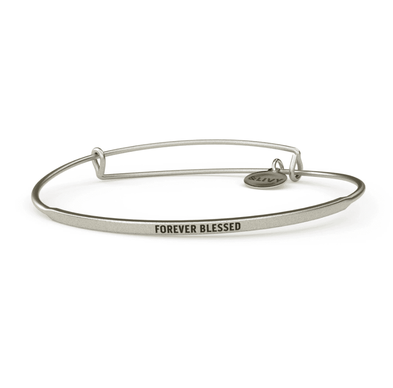 Silver bangle bracelet with the words "Forever Blesses" engraved on it.