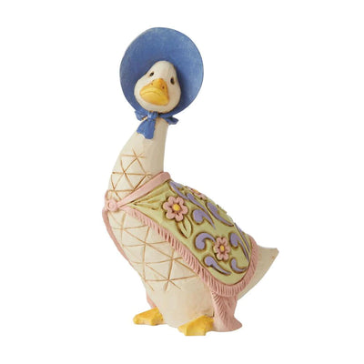 figurine of a duck wearing a blue hat