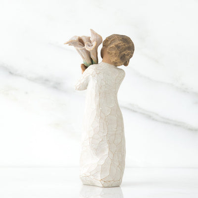 Beautiful Wishes, a Willow Tree with a standing figure in a cream dress, holding a tall bouquet of white calla lilies