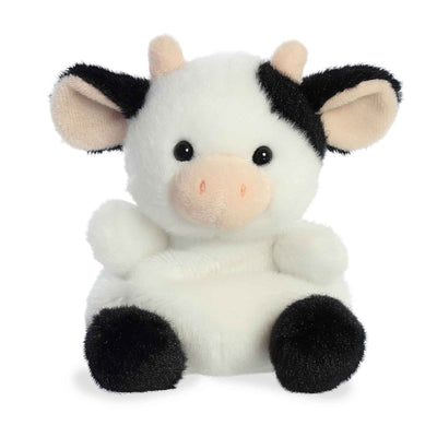 Light brown plush dog with floppy ears, a brown nose, and a black and white spotted belly.