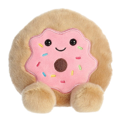 Pink plush donut with rainbow sprinkles and a bite taken out