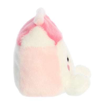 Pink plush pig with a curly tail and a stitched smile