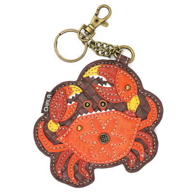 Teal faux leather Chala key fob keychain with orange and teal crab design.