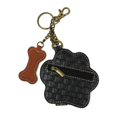 Metal key chain with black paw print and white bone.