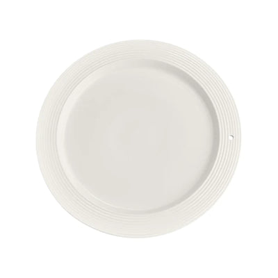White plate with blue rim on white background