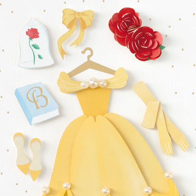 The greeting card features die-cut attachments from Disney's "Beauty and the Beast."