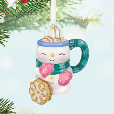 Porcelain ornament shaped like a snowman mug with scarf, pink mittens, marshmallow, caramel drizzle, and snowflake cookie, Hallmark Cup of Cozy series