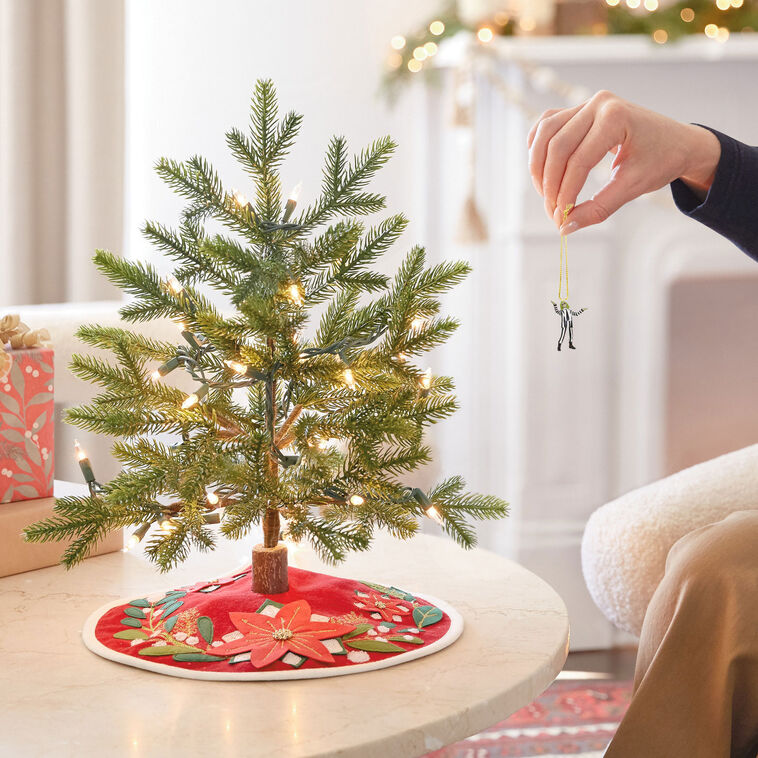Mini Beetlejuice ornament with wild green hair and black-and-white striped suit, arms raised in playful pose.