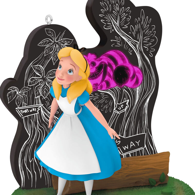 Alice stands in Wonderland before a glowing tree as the Cheshire Cat fades in and out in this Hallmark Keepsake Disney ornament.