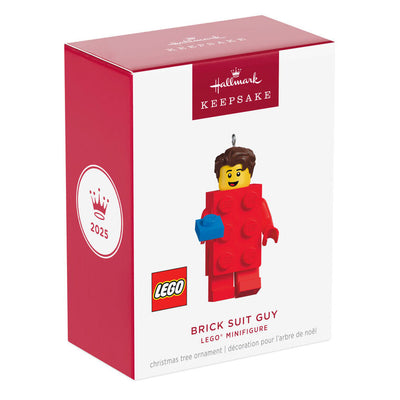 LEGO minifigure ornament with red brick body and blue hand-held piece, smiling boy with brown hair.