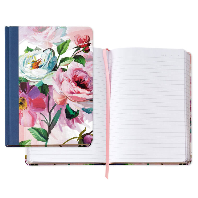 Hardcover journal with purple and pink floral fabric cover, gold-edged pages, and ribbon bookmark.
