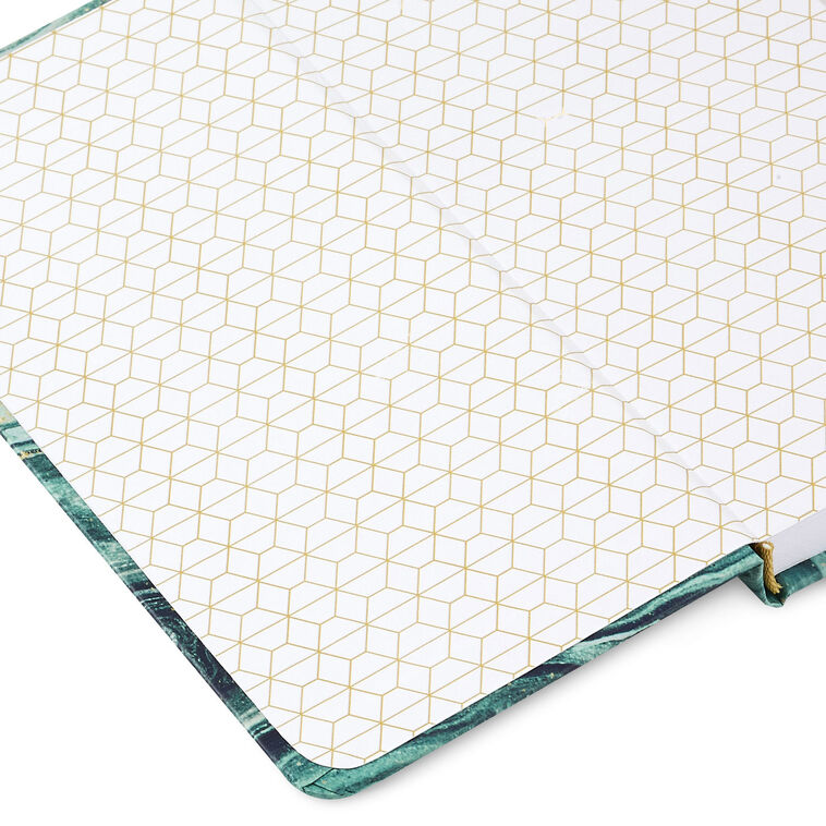 Slim hardcover journal with swirling blue and green marbled cover, gold foil details, and magnetic clasp.
