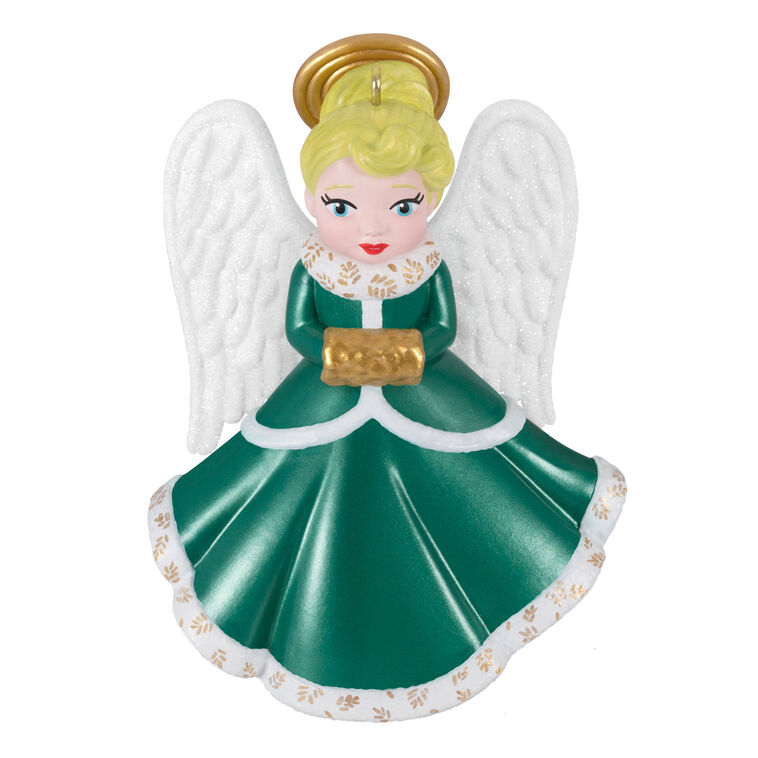 Hallmark Keepsake ornament of blonde angel in green and white dress with gold trim, glittery wings, and gold muff