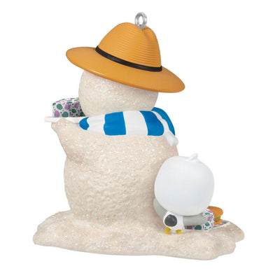 Hallmark Keepsake Sandal the Sandman ornament—sand snowman in Bermuda hat, blue and white scarf, with sub sandwich and sea turtle friend on the beach

