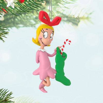 Hallmark Keepsake Dr. Seuss Cindy-Lou Who ornament, in pink nightgown, holding green stocking and candy cane, inspired by How the Grinch Stole Christmas.