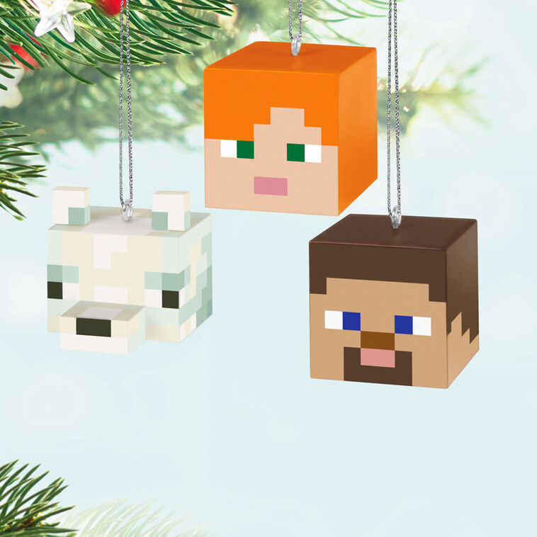 Set of three Minecraft mini ornaments featuring Alex, Steve, and an arctic fox heads in pixelated cube style with dimensional ears.