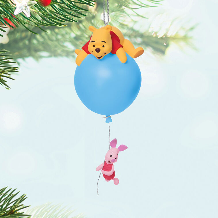 Hallmark Keepsake Disney Winnie the Pooh ornament, Pooh on blue balloon with Piglet hanging, light-up holiday tree decoration.