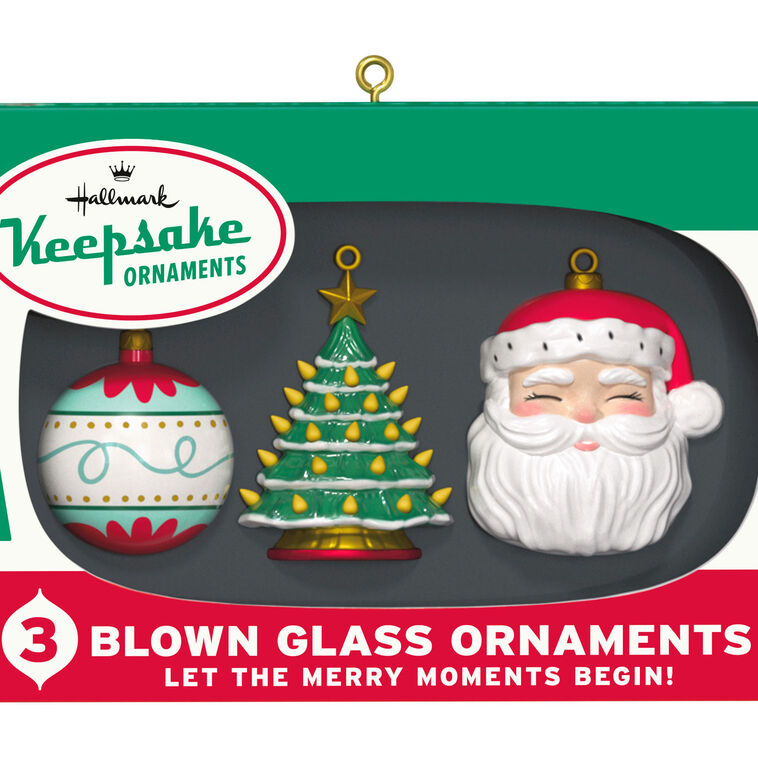 Retro ornament box with three vintage-style glass ornaments: ball, tree, and Santa face