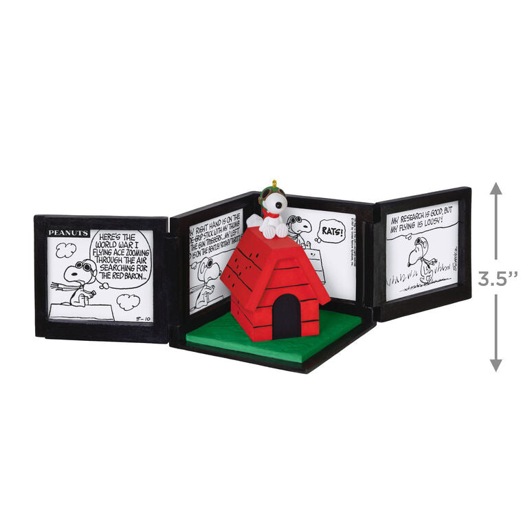 Snoopy as the Flying Ace on red doghouse airplane, comic panel backdrop, Peanuts 75th anniversary Hallmark Christmas musical ornament
