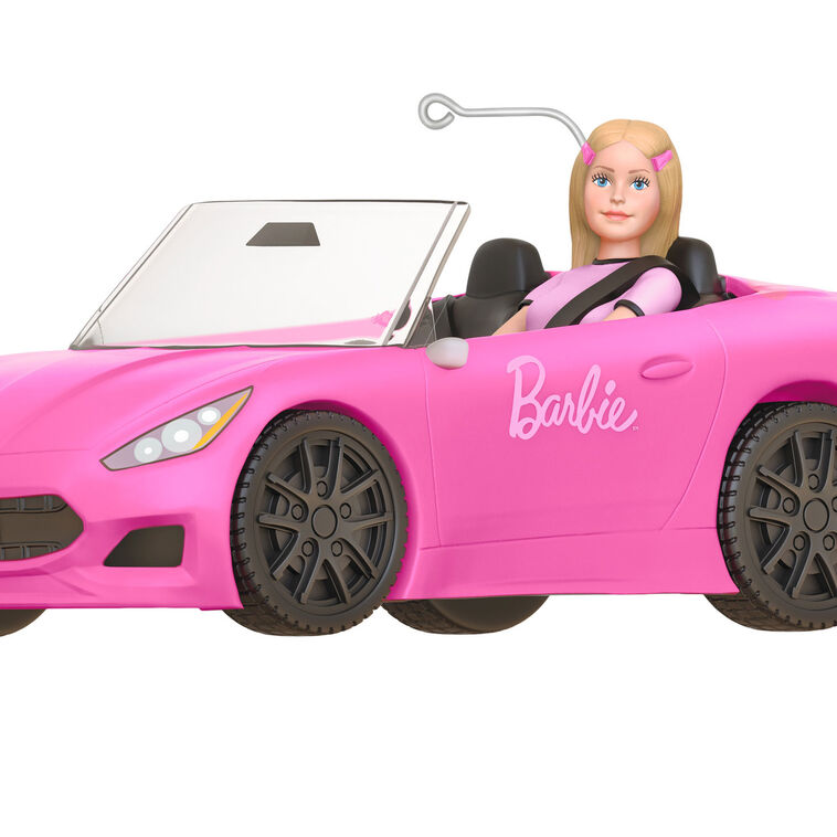 Barbie ornament driving a pink convertible sports car, wearing pink tee and barrettes, Hallmark Keepsake holiday decoration.