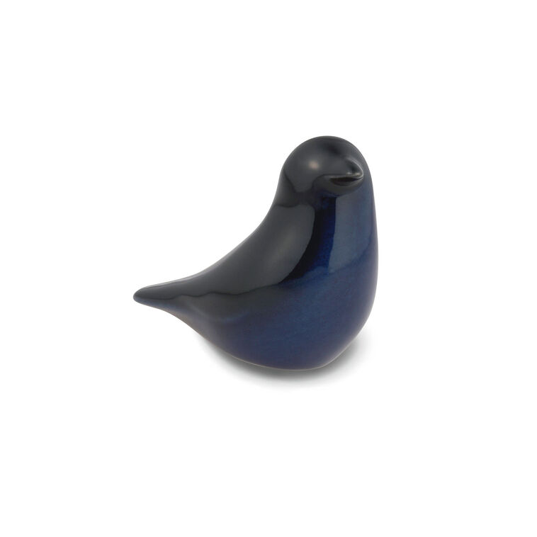 Hallmark raven figurine in glossy black ceramic, symbolizing wisdom and transformation.