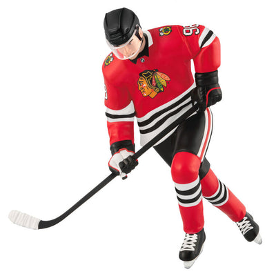 Connor Bedard ornament in Chicago Blackhawks jersey, number 98, action hockey pose, Hallmark NHL Christmas collectible for hockey fans
