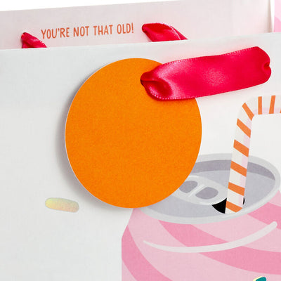 Hallmark gift bag with pink-striped soda can design, green “Chill Out” lettering, bent straw, and die-cut orange tag.