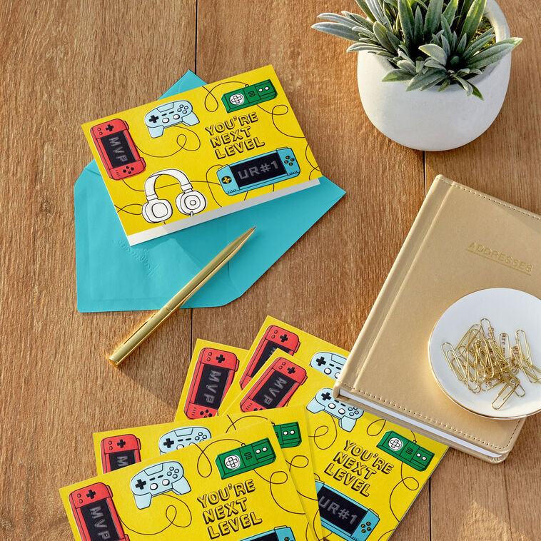 Fun Hallmark blank note cards with video game controllers and cords on a bright yellow background, boxed set of 10 with envelopes.
