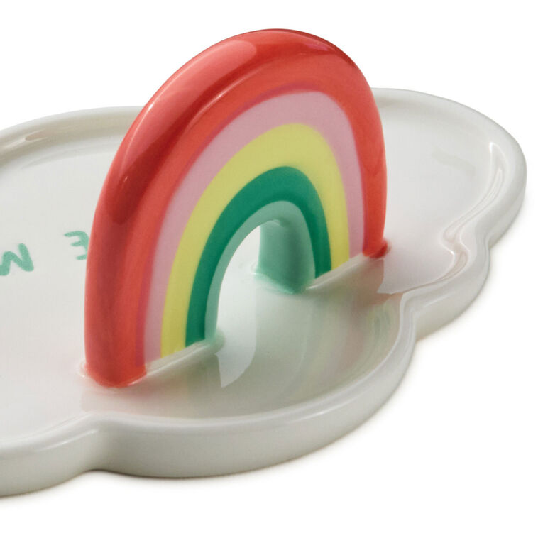 Ceramic cloud-shaped figurine with colorful rainbow arch and “Little Miracle” message in blue lettering.