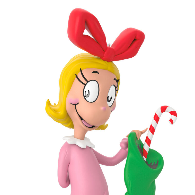 Hallmark Keepsake Dr. Seuss Cindy-Lou Who ornament, in pink nightgown, holding green stocking and candy cane, inspired by How the Grinch Stole Christmas.