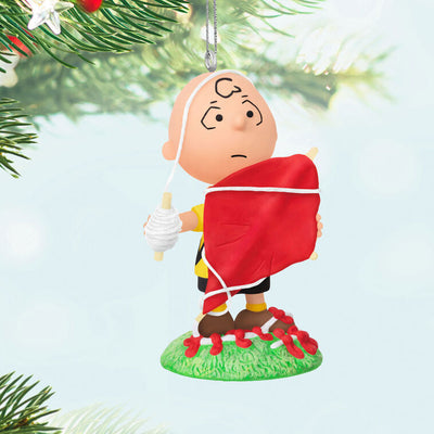 Mini Charlie Brown ornament tangled in red kite string, celebrating 75th anniversary, Hallmark Peanuts Christmas collectible

