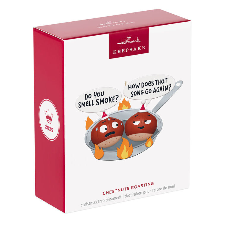 Funny Christmas ornament with two chestnuts roasting in a flaming skillet.

