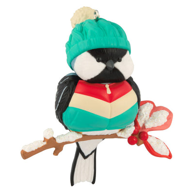 Hallmark Keepsake Cozy Critters ornament—black-capped chickadee in teal stocking hat and striped vest perched on holly branch with glittery snow