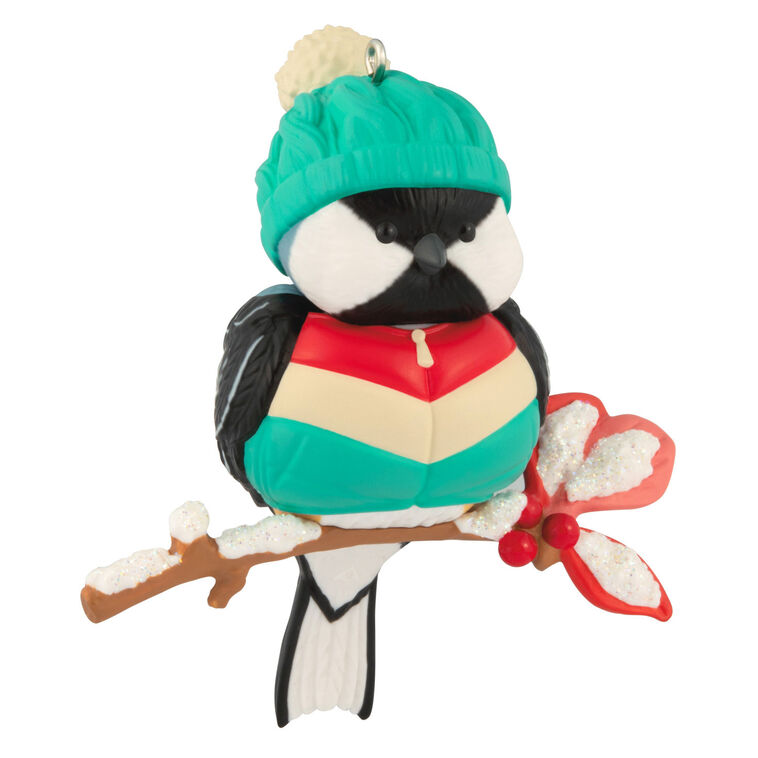 Hallmark Keepsake Cozy Critters ornament—black-capped chickadee in teal stocking hat and striped vest perched on holly branch with glittery snow