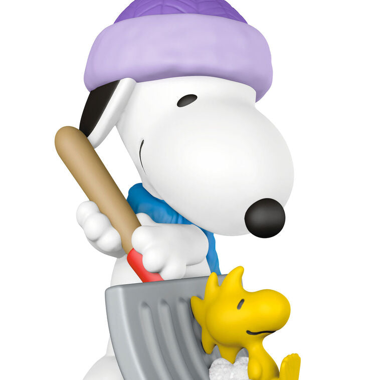 Mini Snoopy ornament in purple hat and scarf shoveling snow, Woodstock riding on shovel, Hallmark Peanuts Christmas collectible