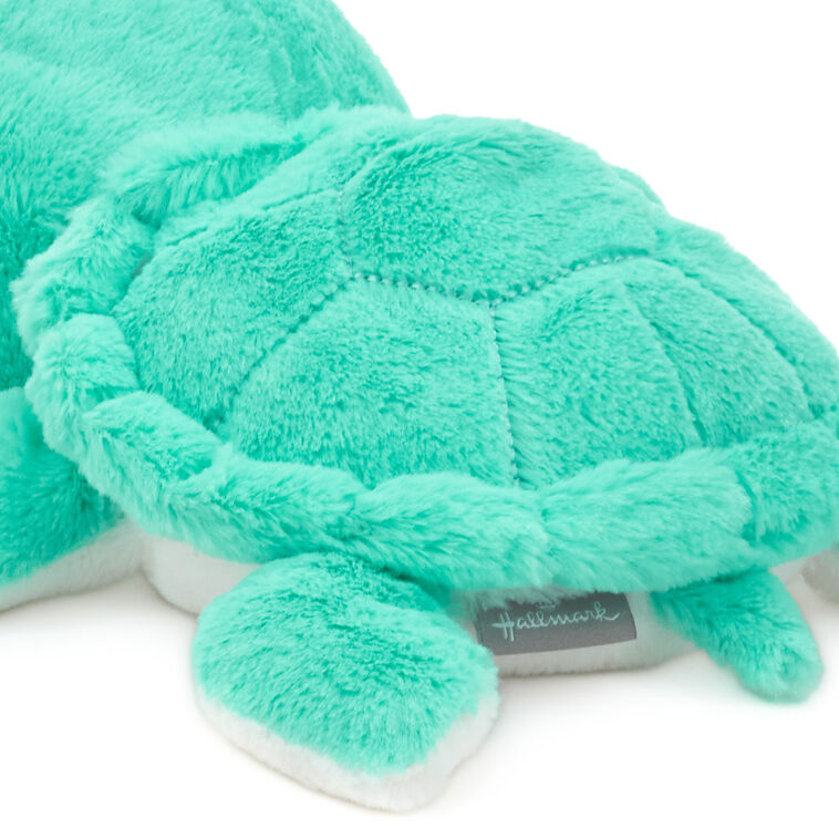 Turquoise sea turtle plush toy with soft white belly, perfect for snuggling, ocean-themed nurseries