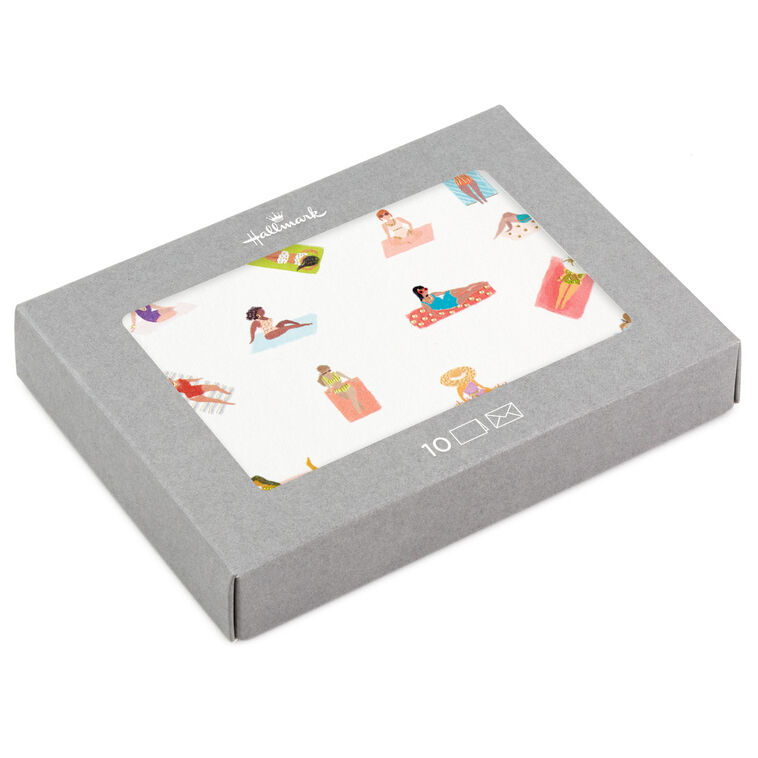 Blank note cards with retro-style illustrations of women sunbathing on colorful beach towels, boxed with envelopes.

