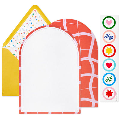Stationery set with arched sheets in colorful wave and coral prints, yellow envelopes, and heart and star seal stickers.
