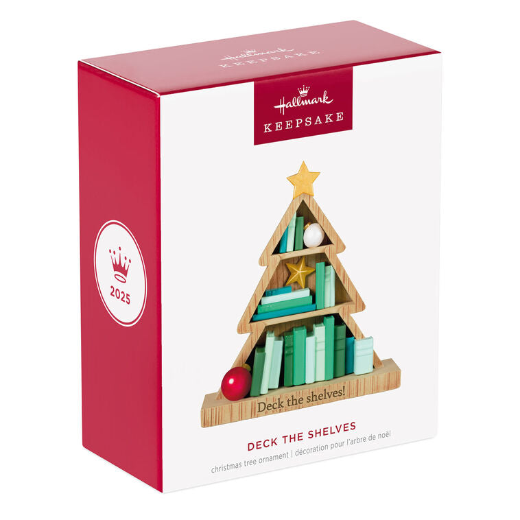Tree-shaped wooden bookcase ornament filled with green books, red and white ornaments, and gold star accents

