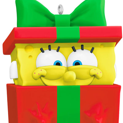 SpongeBob SquarePants ornament, yellow character in red gift box with green bow, Hallmark Keepsake, Christmas tree decoration.
