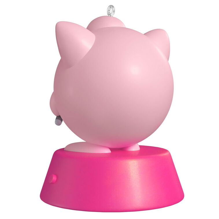 Hallmark Keepsake Pokémon Jigglypuff ornament, pink and round, singing into green microphone, with sound, on pink base.