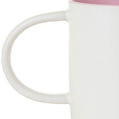 White ceramic mug with “Mom Sweet Mom” in colorful cross-stitch-style lettering and floral accents, oversized handle.